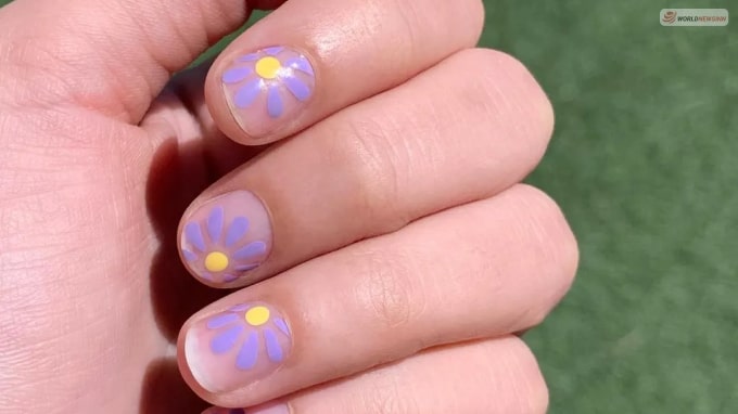 Purple flowers on clear nails